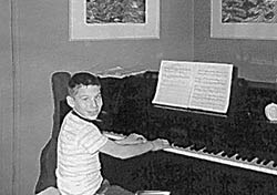 Stephen Schwartz at age seven at the piano